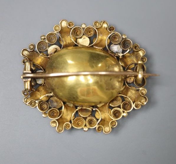 A Victorian yellow metal, foil backed amethyst and white paste set oval brooch, 34mm, gross 9.2 grams.